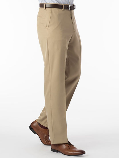 A man wearing the Ballin Dunhill Micro Nano Traditional Flat Front Pant in Tan and a tan shirt made of microfiber gabardine fabric.