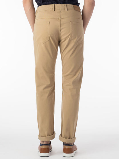 The back view of a man wearing Ballin Crescent Modern 5 Pocket Twill Pants in Khaki.