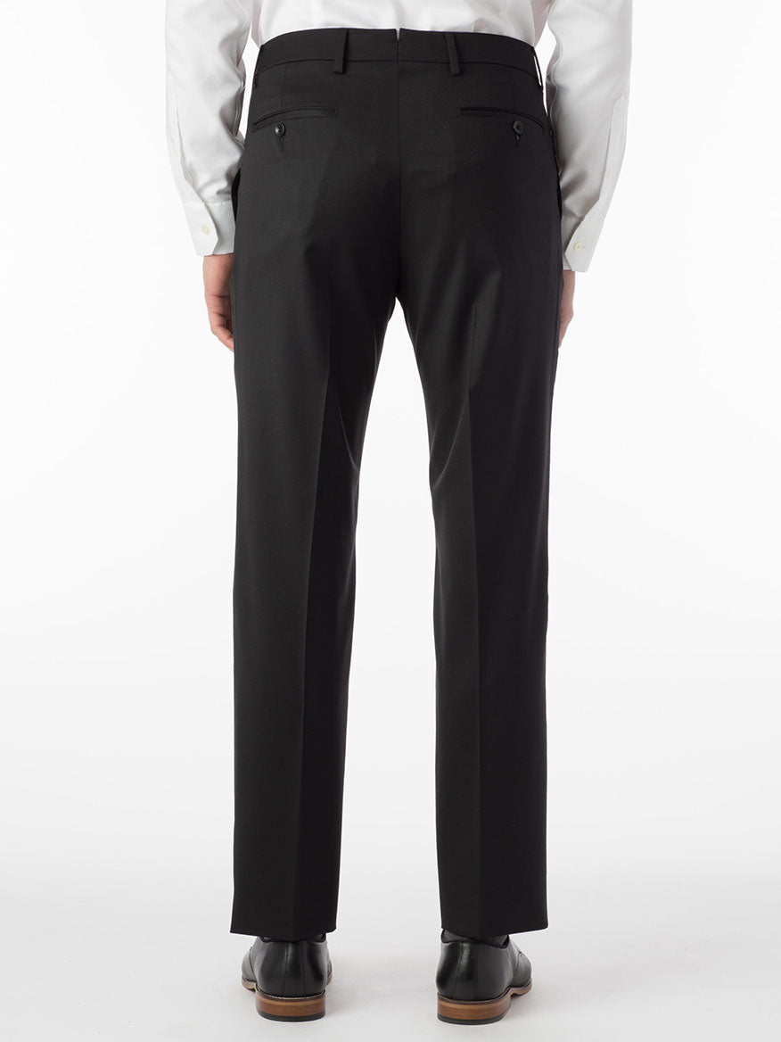 The back view of a man wearing the Ballin Houston Super 130s Modern Flat Front Pant in Black, an esteemed Italian brand.