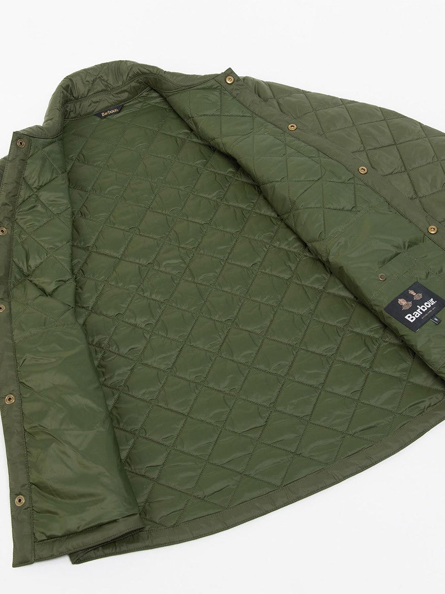 A Barbour Newbie Quilted Jacket in Olive with stud fastenings on a white surface.