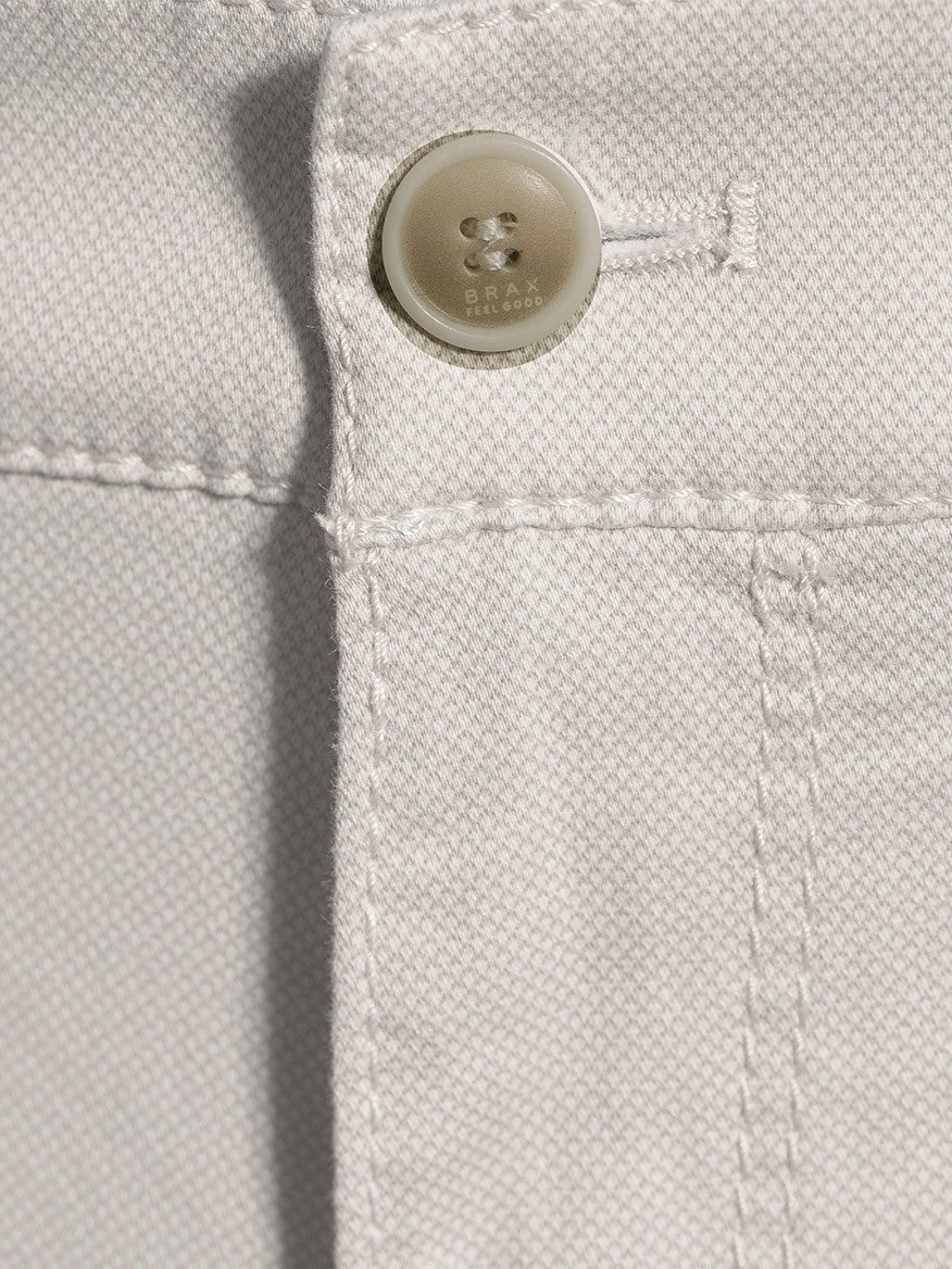 Close-up of a Brax Bari Triplestone Printed Modern Fit Short in Sand with detailed stitching and a button.