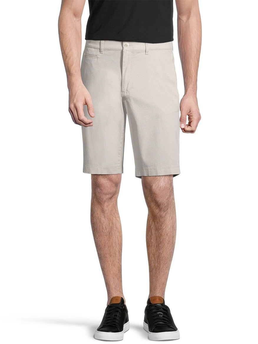 Man wearing Brax Bari Triplestone Printed Modern Fit Short in Sand and black sneakers standing against a white background.