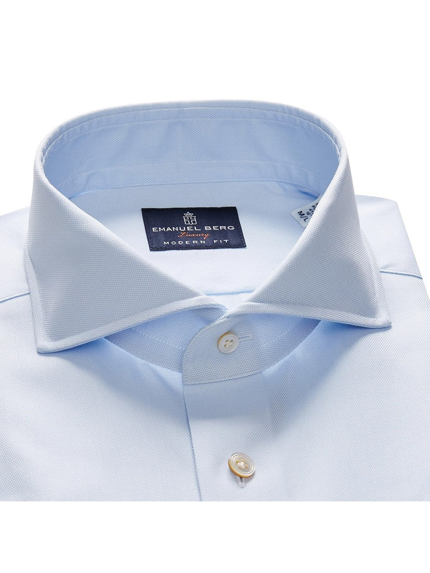 Close-up of an Emanuel Berg Premium Luxury Dress Shirt in Light Blue with a Harvard collar and Mother of Pearl buttons.