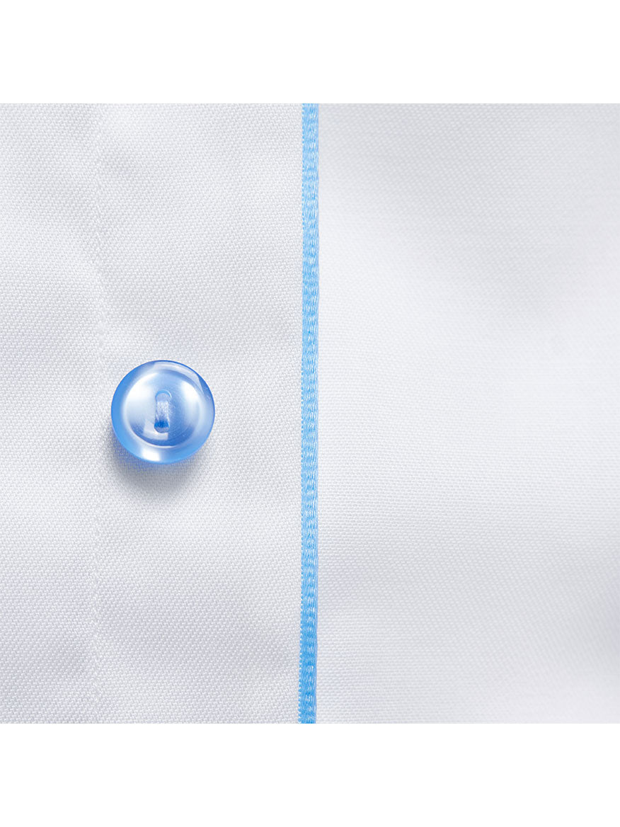 Close-up of a blue button on an Eton Slim Fit White Twill Dress Shirt With Blue Details.