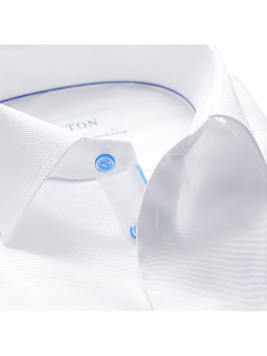 Close-up of a white Eton Slim Fit White Twill Dress Shirt With Blue Details.