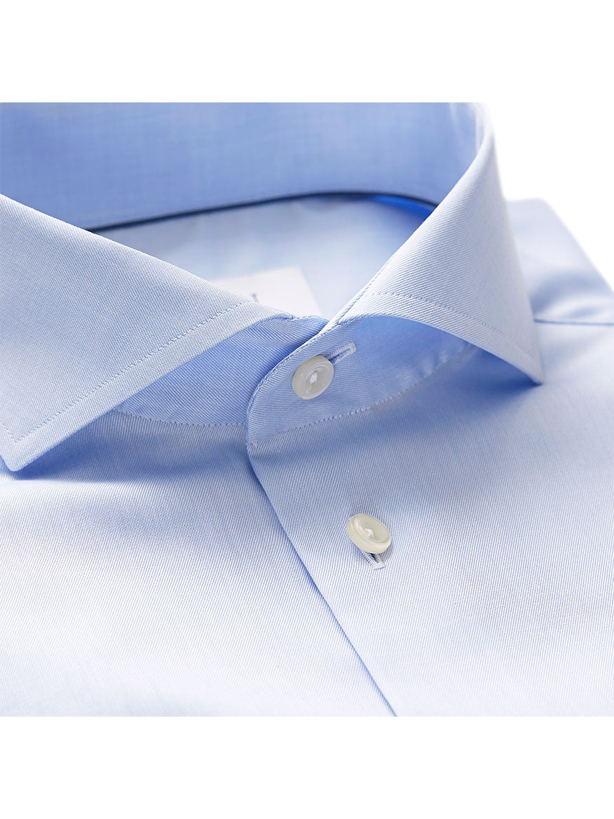 Close-up of the Eton Slim Fit Sky Blue Extreme Cut Away Dress Shirt, featuring a sharp cutaway collar and white buttons, neatly folded.