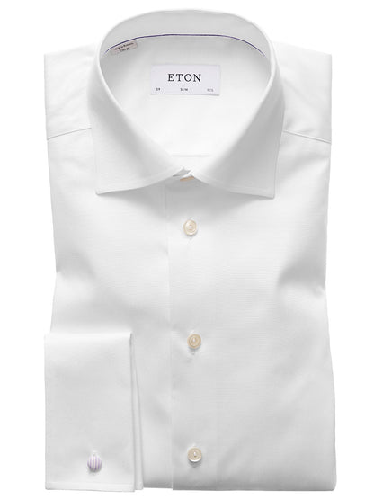 The Eton Slim Fit White French Cuff Dress Shirt features a classic collar and wrinkle-free finish, neatly folded and displayed against a white background.