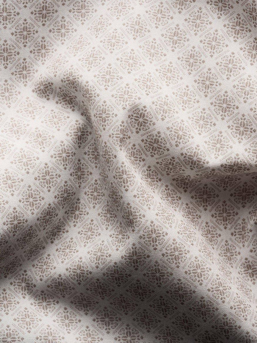 Close-up view of a delicate Eton Brown Signature Poplin Shirt in Medallion Print fabric with intricate floral patterns, draped to form soft folds and contemporary fit.