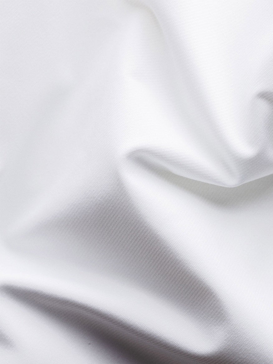 Sentence with product name: Smooth Eton White Four-Way Stretch Shirt fabric with gentle folds and creases.