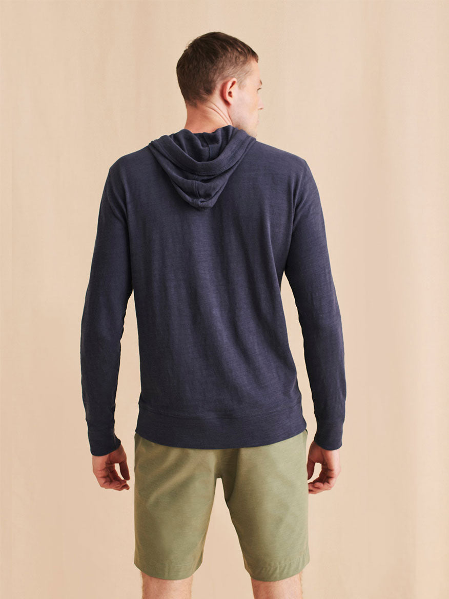 The back of a man wearing a Faherty Brand Slub Cotton Hoodie in Blue Nights.