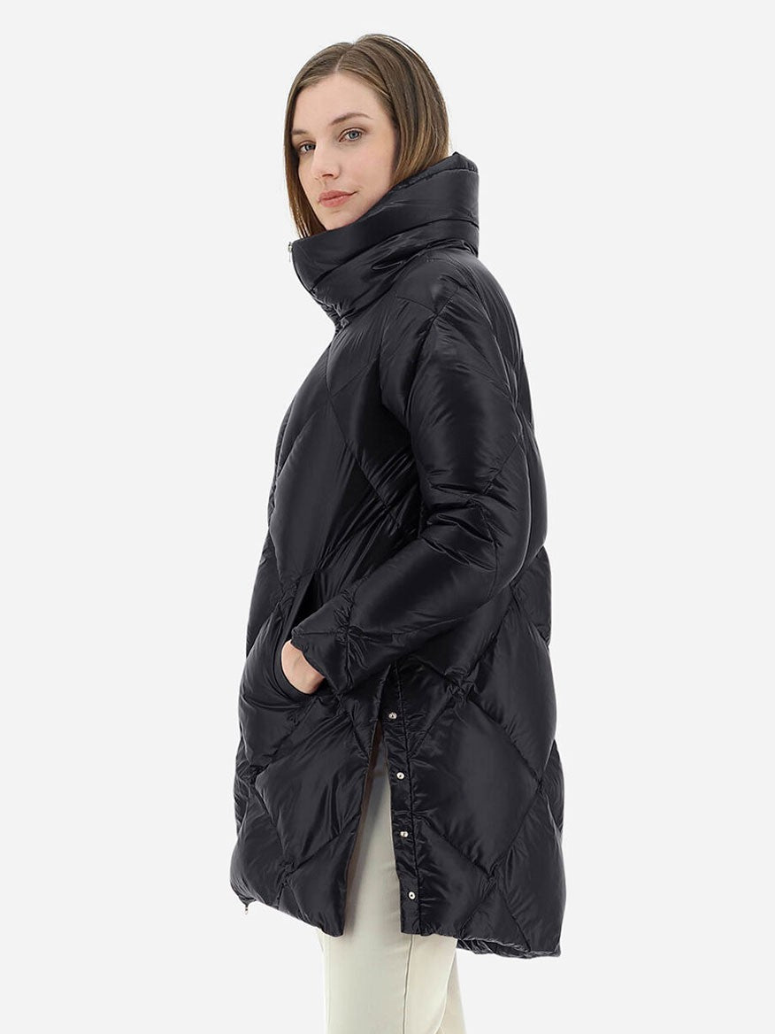 A woman wearing the Herno Ultralight Nylon A-Shape Jacket in Black with goose down padding.