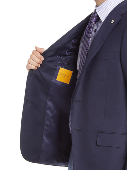 A modern gentleman's lifestyle is epitomized by the Hickey Freeman Navy Traveler Honey Way Blazer paired with a yellow tie.