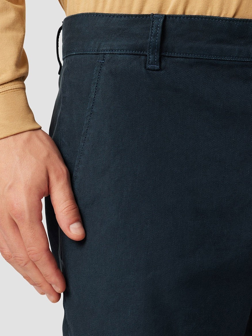 Person with hand in the pocket of Hudson Chino Shorts in Night Blue.