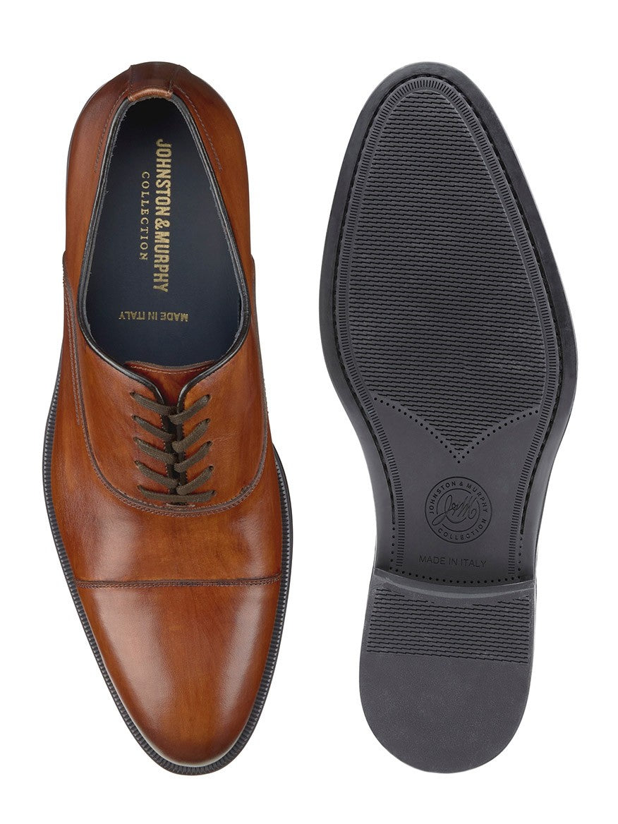 A pair of J & M Collection Flynch Cap Toe in Tan Italian Calfskin derby shoes from Italy on a white background.