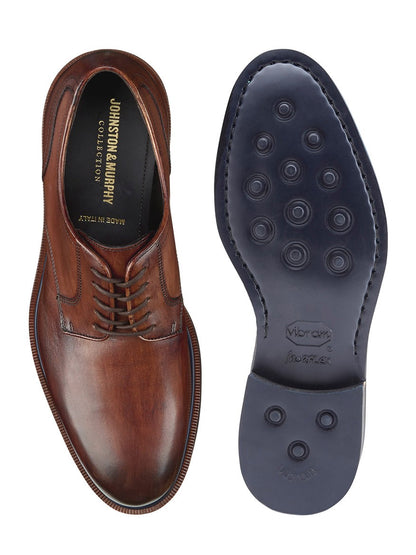 A pair of J & M Collection Hartley Plain Toe in Brown Italian Calfskin derby shoes on a white background.