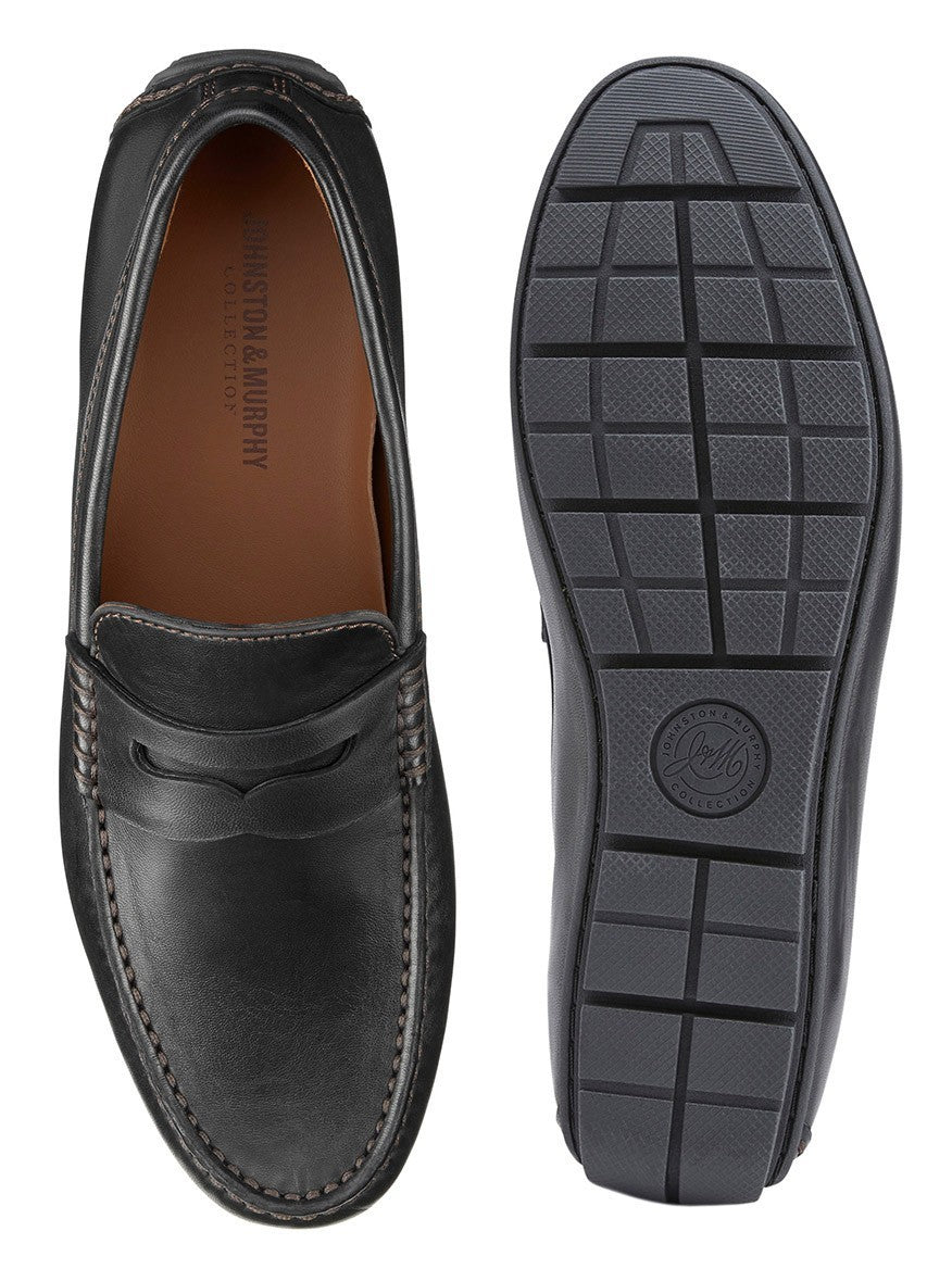 J & M Collection Baldwin Driver Penny in Black Sheepskin loafer with detailed stitching shown from above and its black rubber driver outsole displayed beside it.