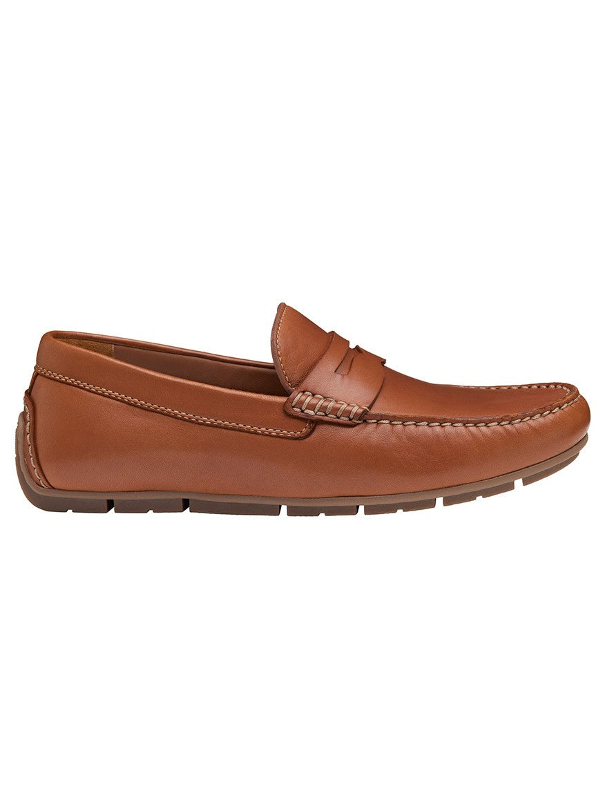 A single J & M Collection Baldwin Driver Penny in Cognac Sheepskin with a rubber driver outsole.