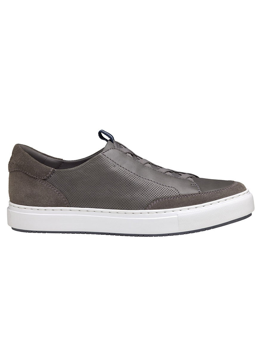 A retro-style men's J & M Collection Anson Stretch Lace-to-Toe Grey English Suede/Sheepskin slip on sneaker from the Johnston & Murphy Collection, featuring white soles.