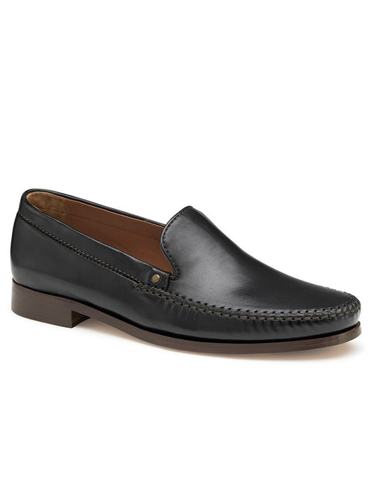 A men's J & M Collection Baldwin Whipstitch Venetian in Black Sheepskin with a leather sole from the Johnston & Murphy Collection.