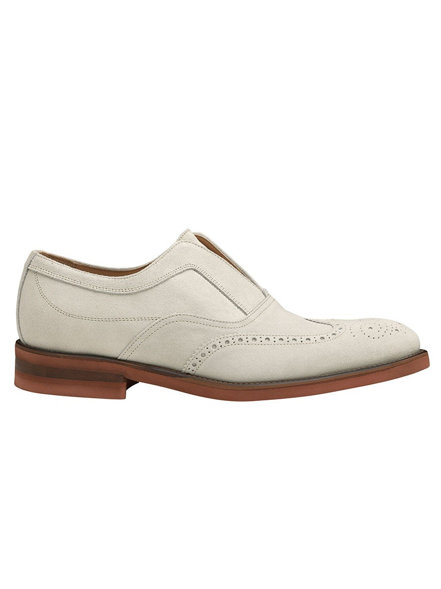 J & M Collection Ashford Wingtip Slip-On in Bone Italian Suede men's dress shoe with brogue detailing on a white background.