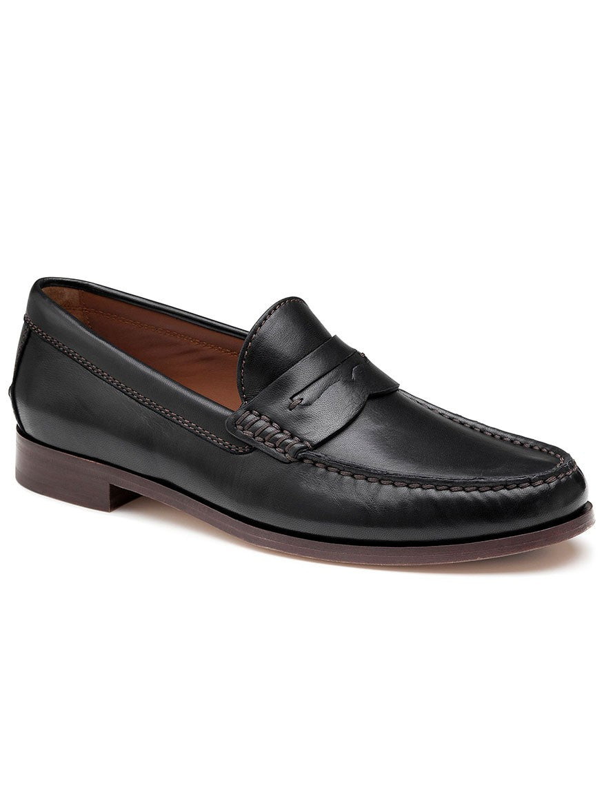 A J & M Collection Baldwin Penny in Black Sheepskin loafer with a brown sole made from sheepskin leather.