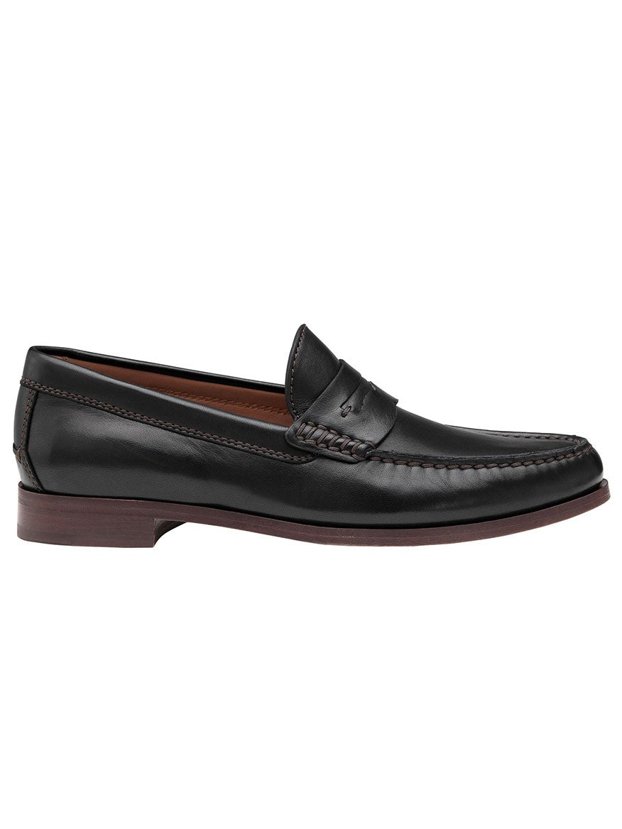A J & M Collection Baldwin Penny in Black Sheepskin men's loafer, made from sheepskin leather, featuring a cushioned footbed, on a white background.