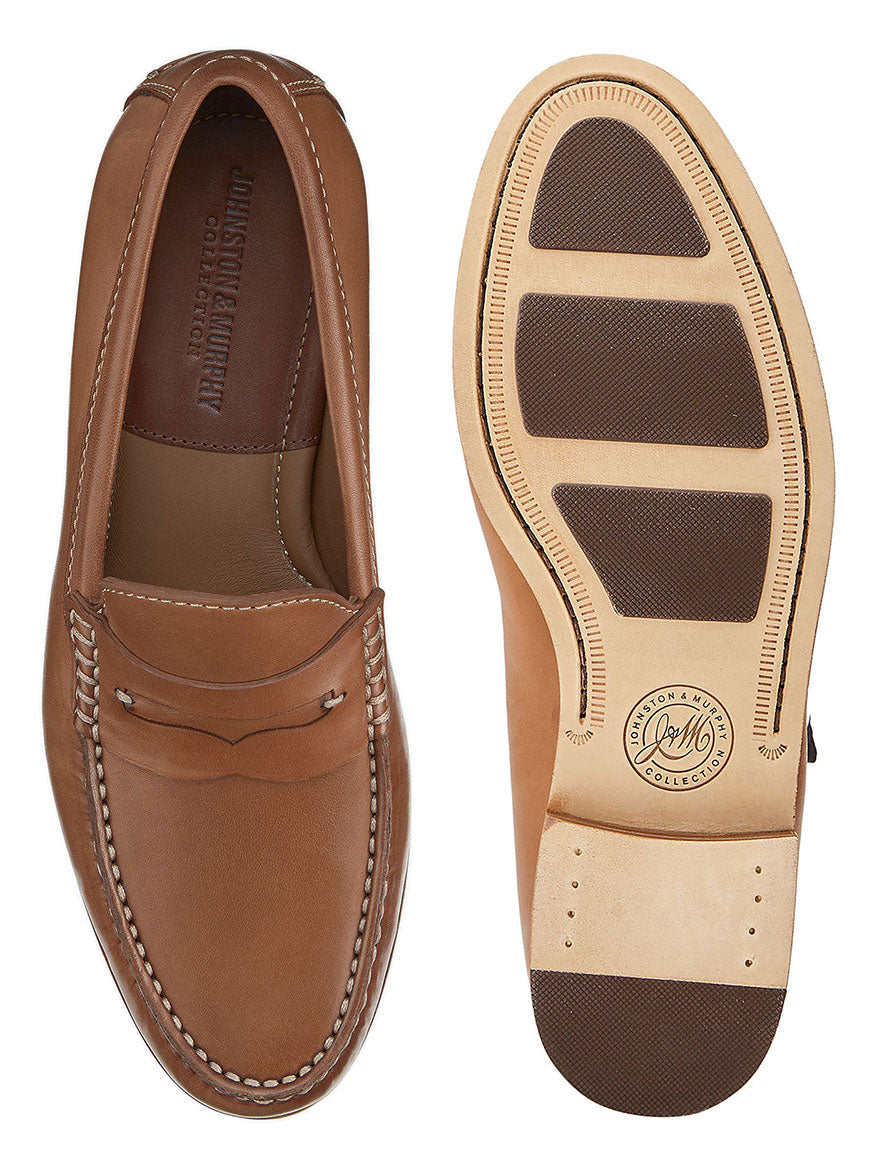 A pair of J & M Collection Baldwin Penny in Cognac Sheepskin men's tan leather loafers on a white background.