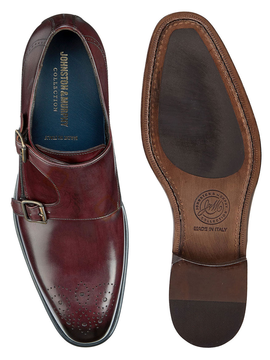 A pair of J & M Collection Ellsworth Monk Strap shoes in Bordeaux Italian Calfskin leather with a hand-stained finish.