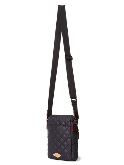 The MZ Wallace Metro Crossbody in Black Oxford is a quilted bag with an adjustable strap and a small Italian leather trim patch on the front.