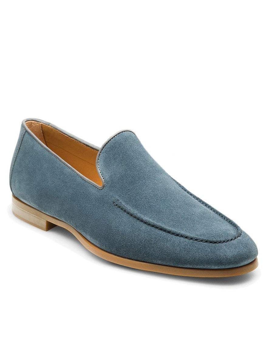 The Magnanni Lecera in Indigo Suede is a single venetian apron toe loafer with a tan sole and interior, shown against a white background. This flexible dress shoe blends elegance and all-day comfort.