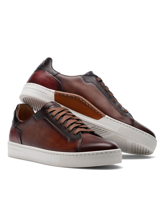 A pair of Magnanni Amadeo in Cognac & Midbrown cupsole men's luxury fashion sneakers made with smooth brown leathers.