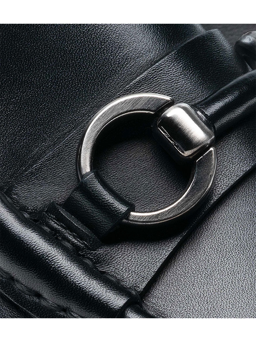 Close-up of the Magnanni Blas II in Black, showcasing a black leather strap with a silver metal ring and clasp detail, evoking the craftsmanship found in bit loafers handmade in Spain.