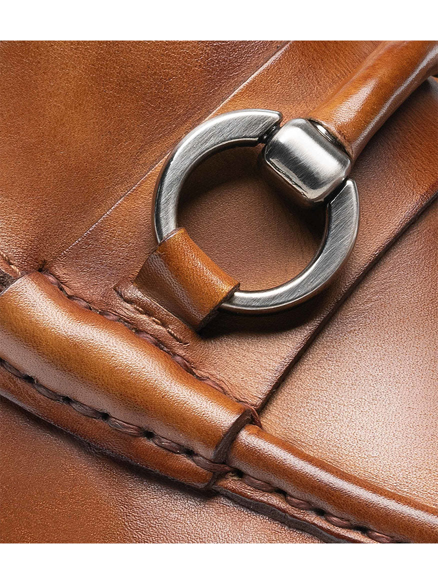 A close up of a brown leather Magnanni Blas II in Tabaco bag with a metal buckle.
