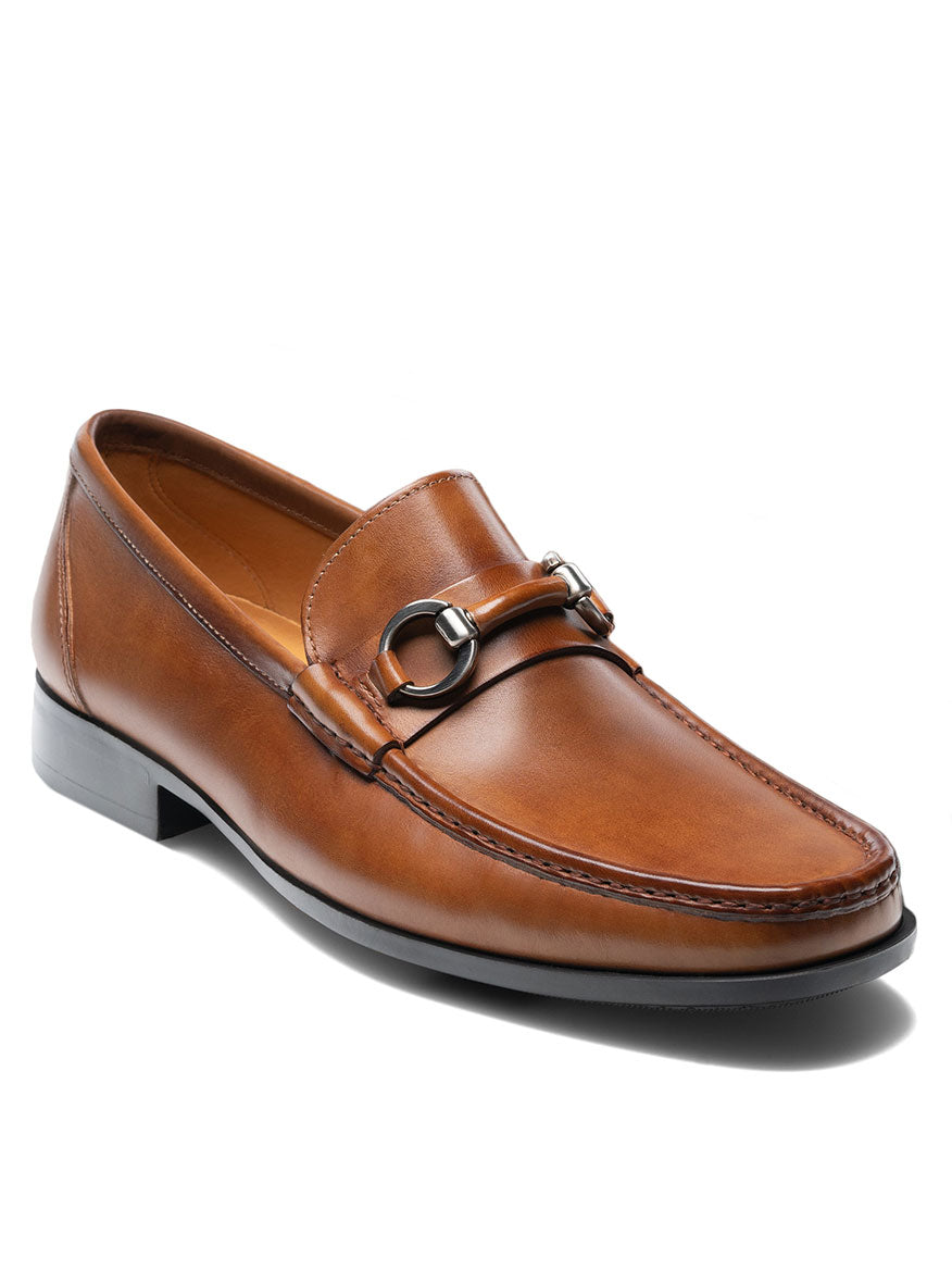 The Magnanni Blas II in Tabaco is a sleek tan loafer featuring a stylish buckle accent on the side.