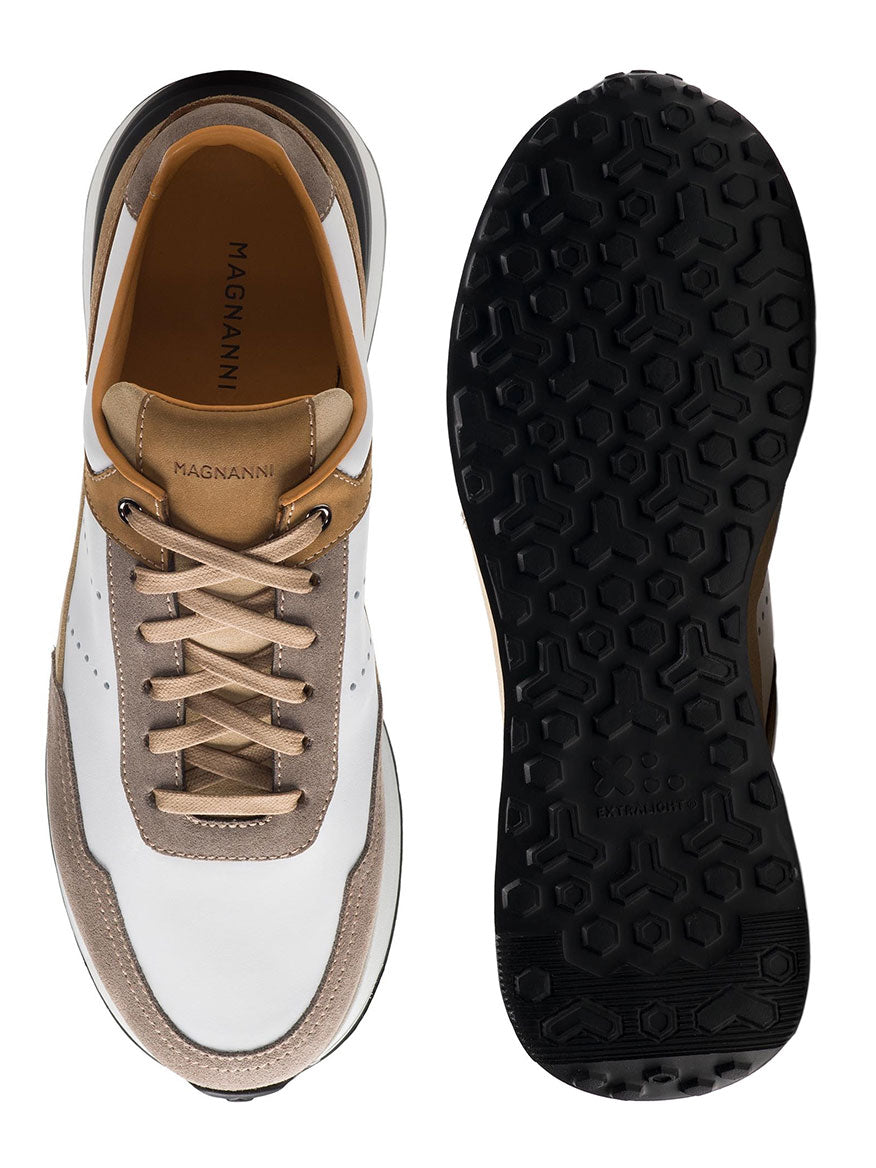 The Magnanni Bravo in White/Beige sneakers are shown from the top and bottom, featuring white, beige, and brown leather with a black textured sport sole.
