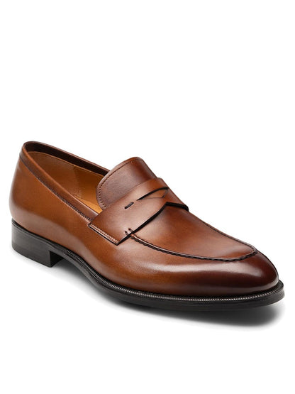 A Magnanni Garner in Tabaco penny loafer with a black sole.