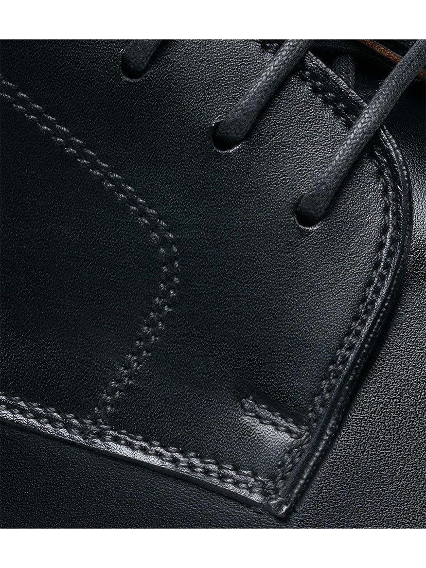 Close-up of Magnanni Harlan in Black calfskin leather derby shoe with laces and detailed stitching.
