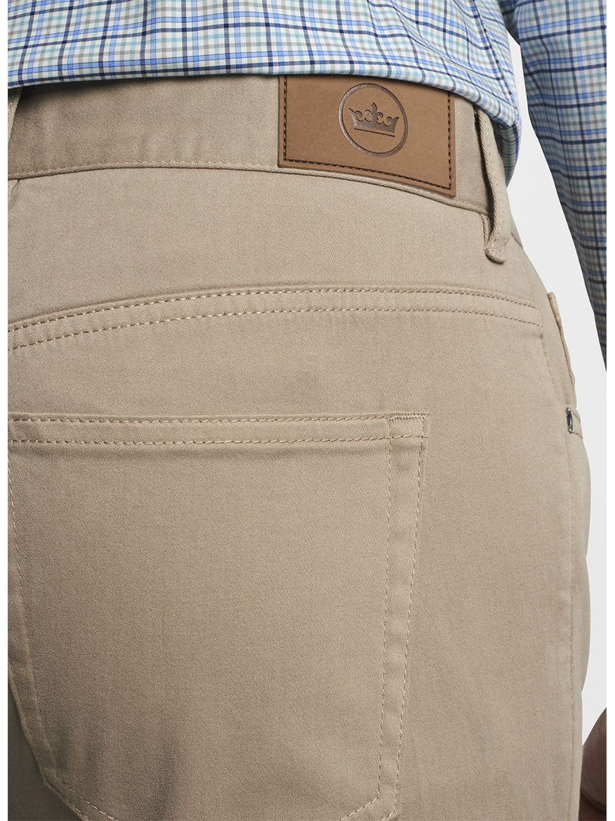 The back view of a man wearing the Peter Millar Ultimate Sateen Five-Pocket Pant in Grain.