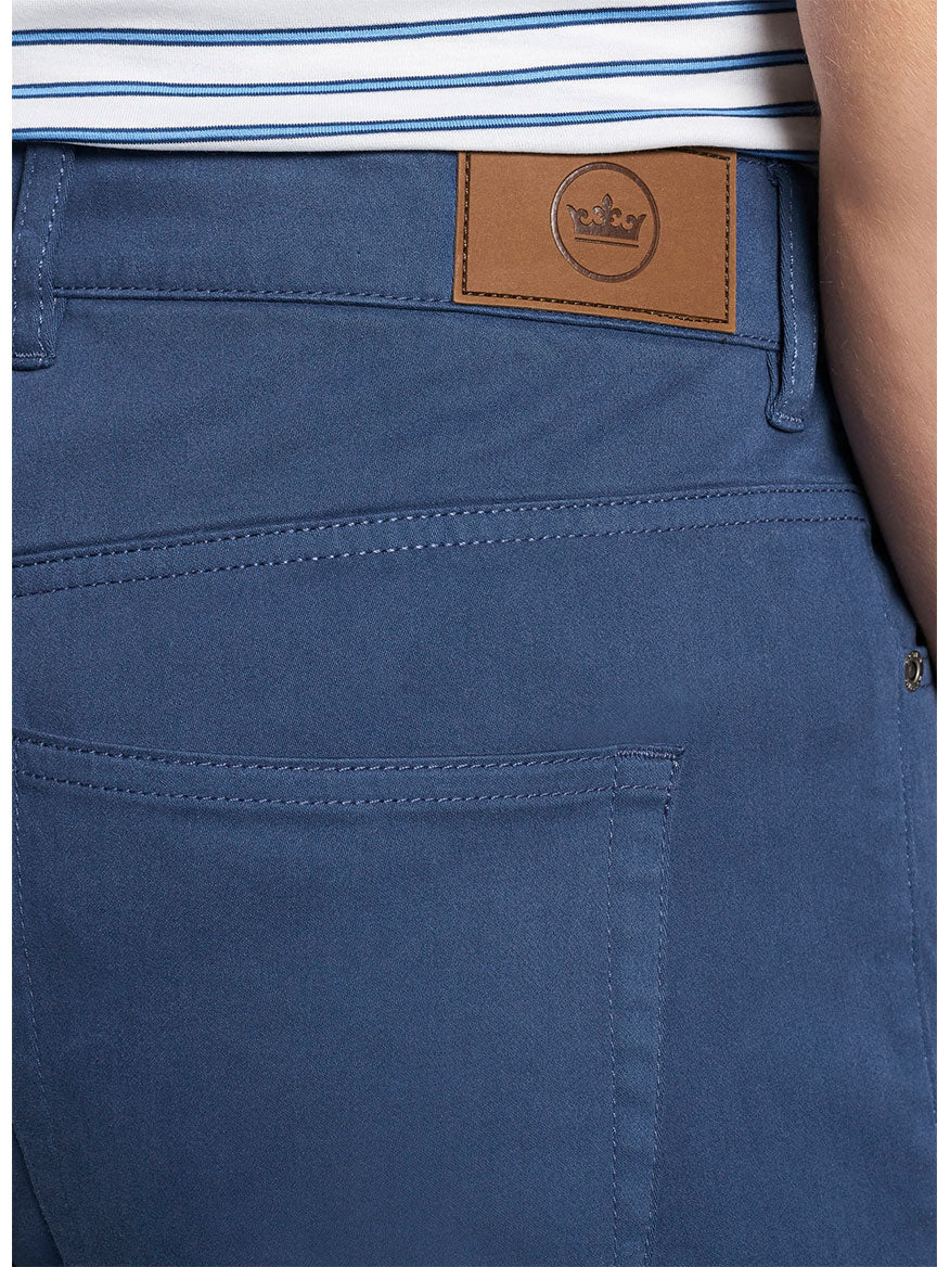 A man's Peter Millar Ultimate Sateen Five-Pocket Pant in Navy with a back pocket.