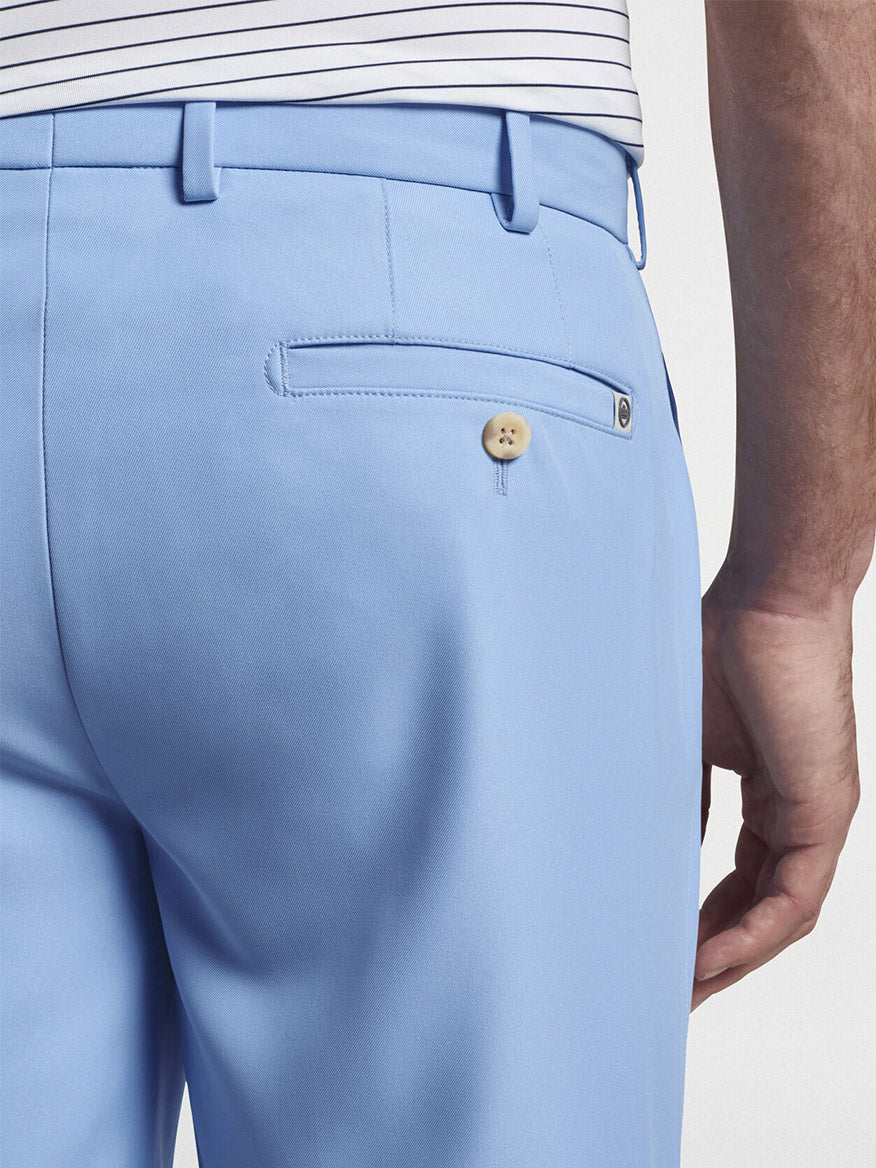Close-up of Peter Millar Salem High Drape Performance Short in Cottage Blue with a focus on the back pocket detailing.
