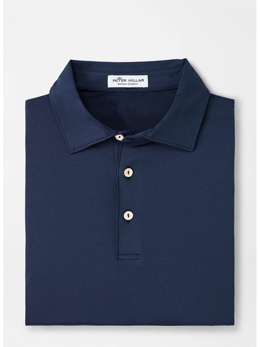 The Peter Millar Solid Performance Jersey Polo in Navy is a men's navy four-way stretch performance polo shirt with a moisture-wicking surface.