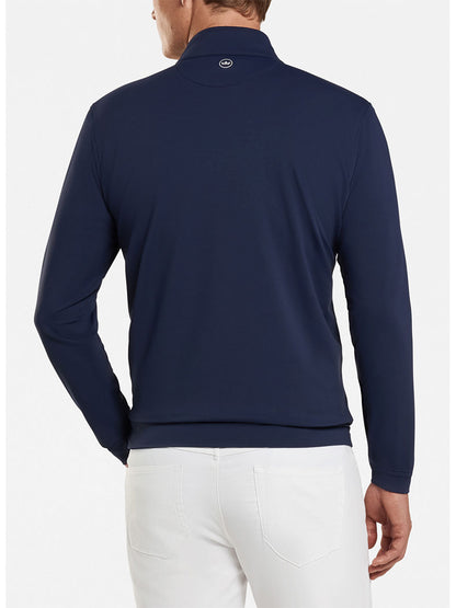 The back view of a man wearing a Peter Millar Perth Performance Quarter-Zip in Navy, emphasizing comfort and performance-focused design.