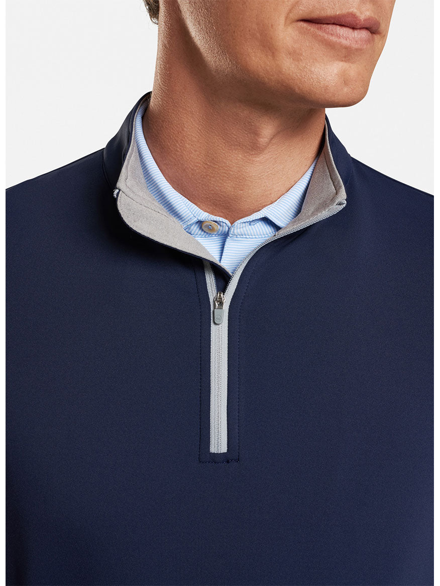 The Peter Millar Perth Performance Quarter-Zip in Navy offers both comfort and style.