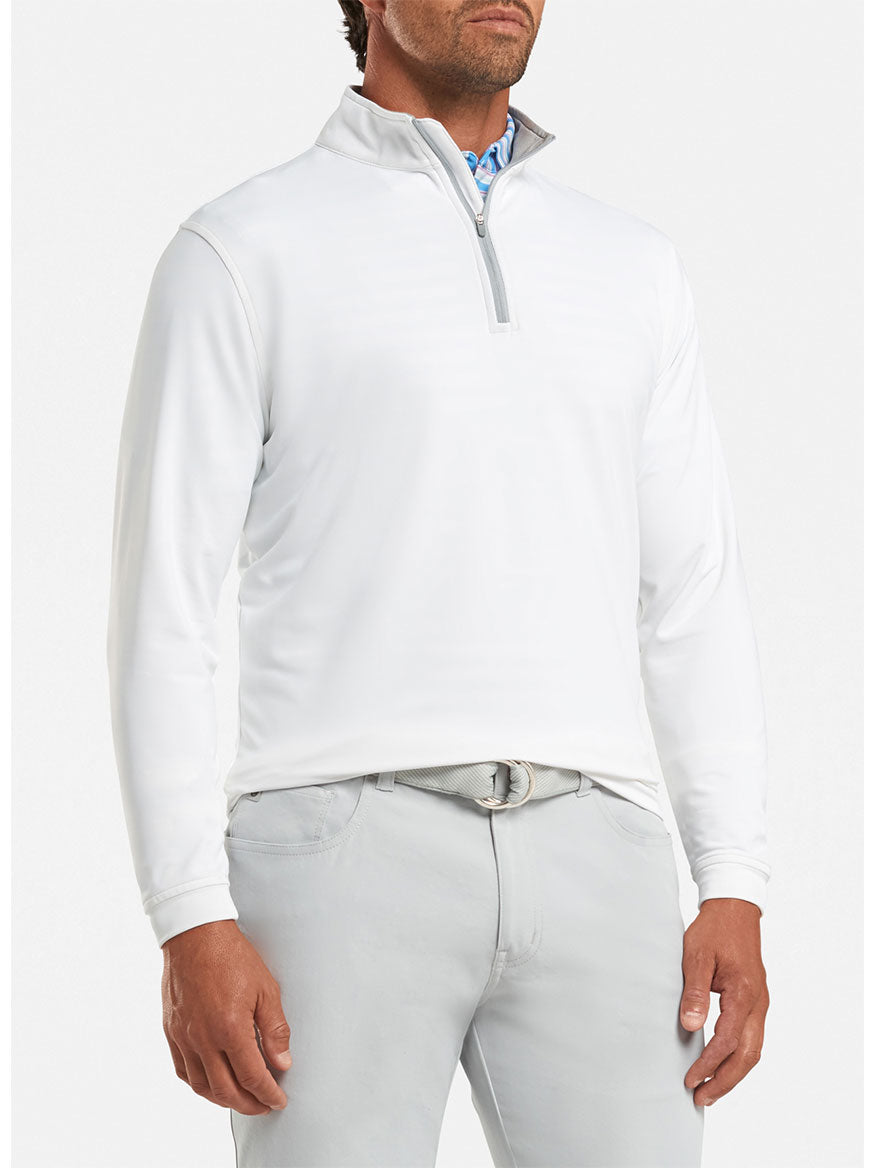 Peter Millar Perth Performance Quarter-Zip in White sweater worn by a man.