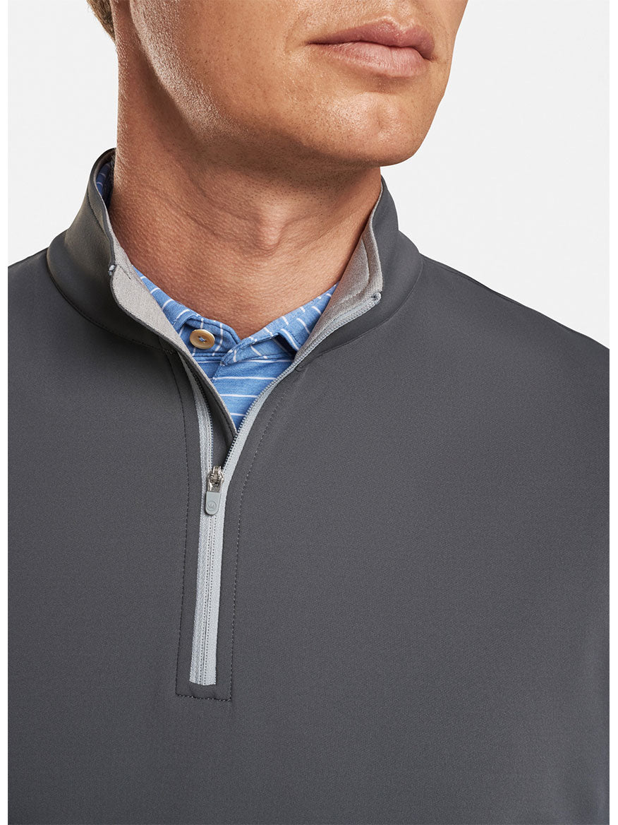 A man is wearing a Peter Millar Galway Performance Quarter-Zip Vest in Iron.