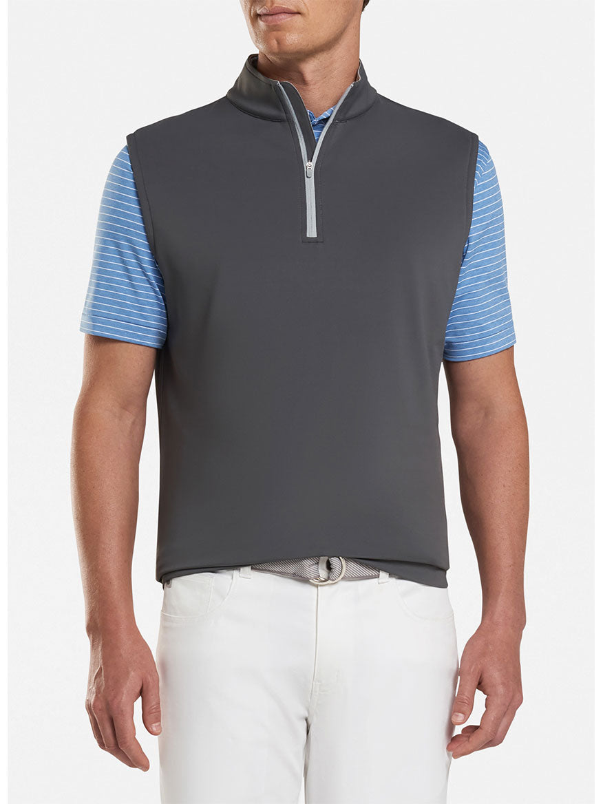 The Peter Millar Galway Performance Quarter-Zip Vest in Iron is grey and blue, offering UPF 50+ sun protection and moisture-wicking properties.
