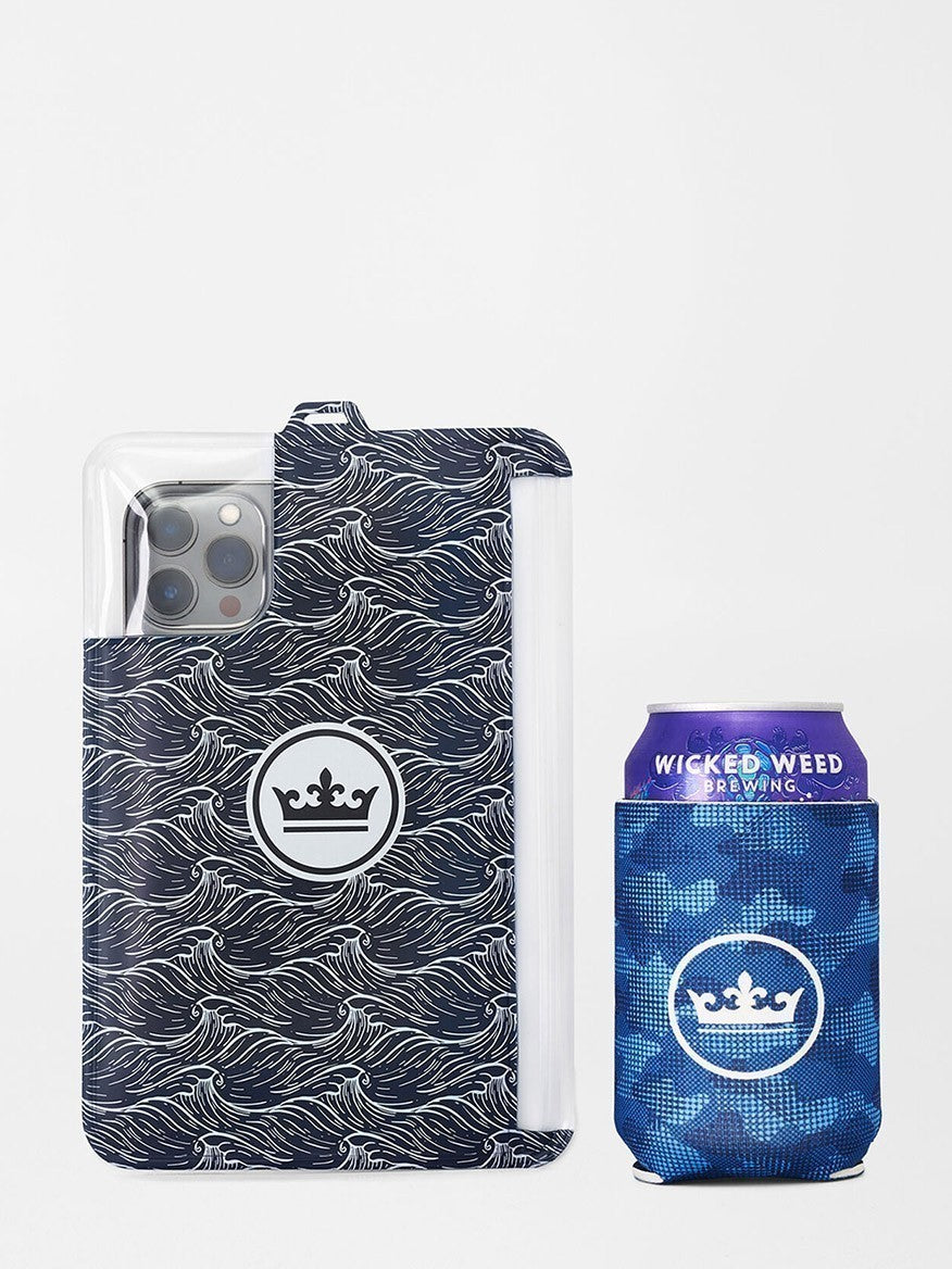 A smartphone with a patterned case beside a matching patterned can of wicked weed brewing beverage and Peter Millar Camouflaged Coastline Swim Trunk in Navy with a 7" inseam.