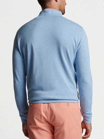 The back of a man wearing a Peter Millar Crown Comfort Pullover in Cottage Blue.