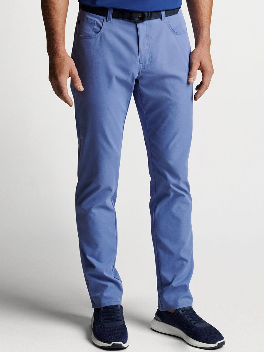 A man wearing Peter Millar eb66 Performance Five-Pocket Pant in Port Blue.