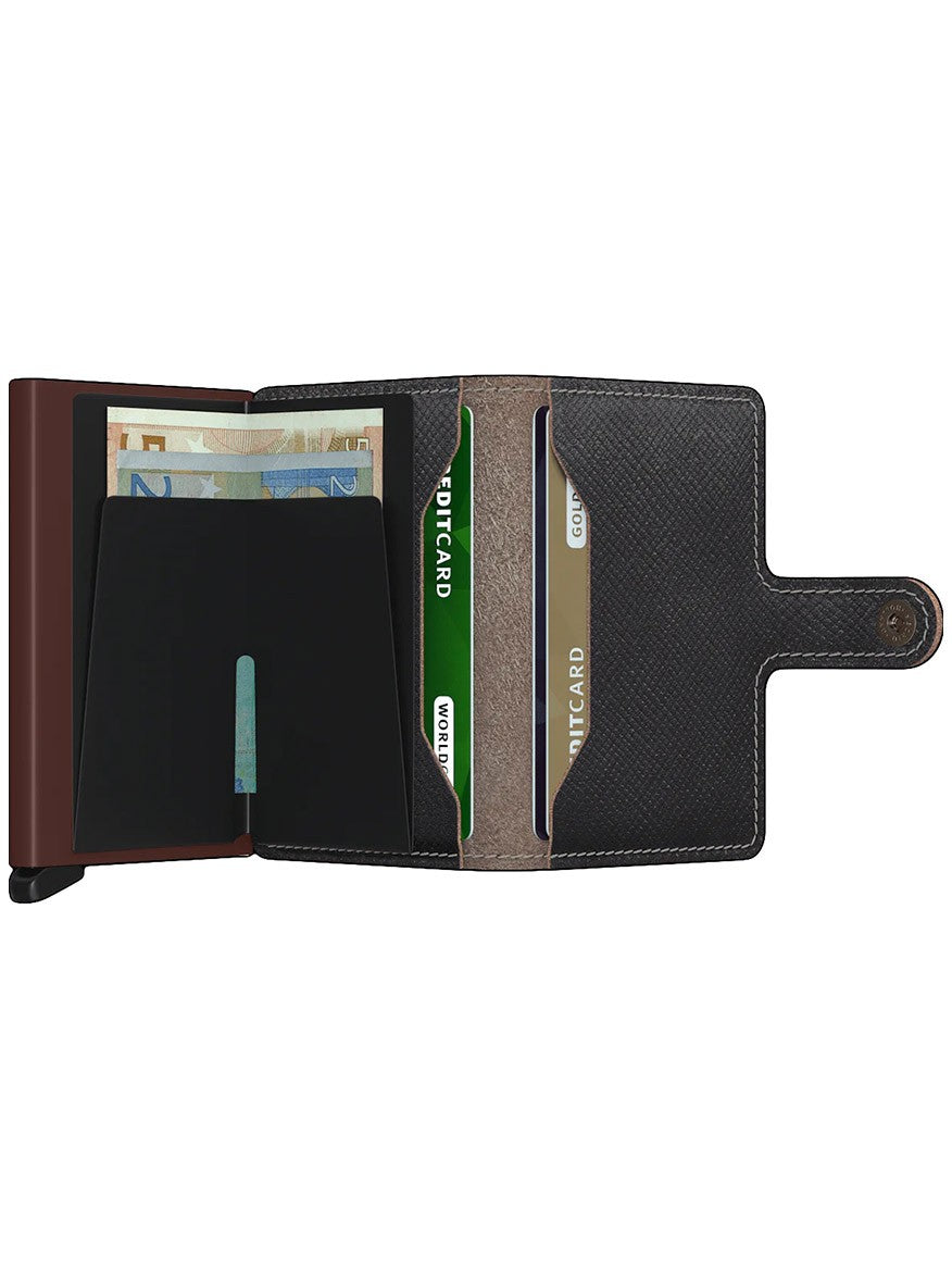 Open Secrid Miniwallet Saffiano in Brown displaying cash and multiple credit cards with RFID protection.